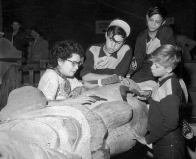 Ellen Neel teaching totem pole carving to her sons