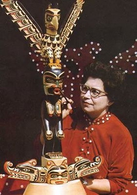Ellen Neel putting the final touches on a totem pole
